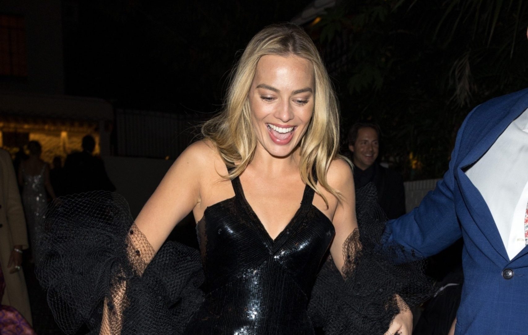 Margot Robbie is all smiles as she leaves a 2024 Golden Globes ...